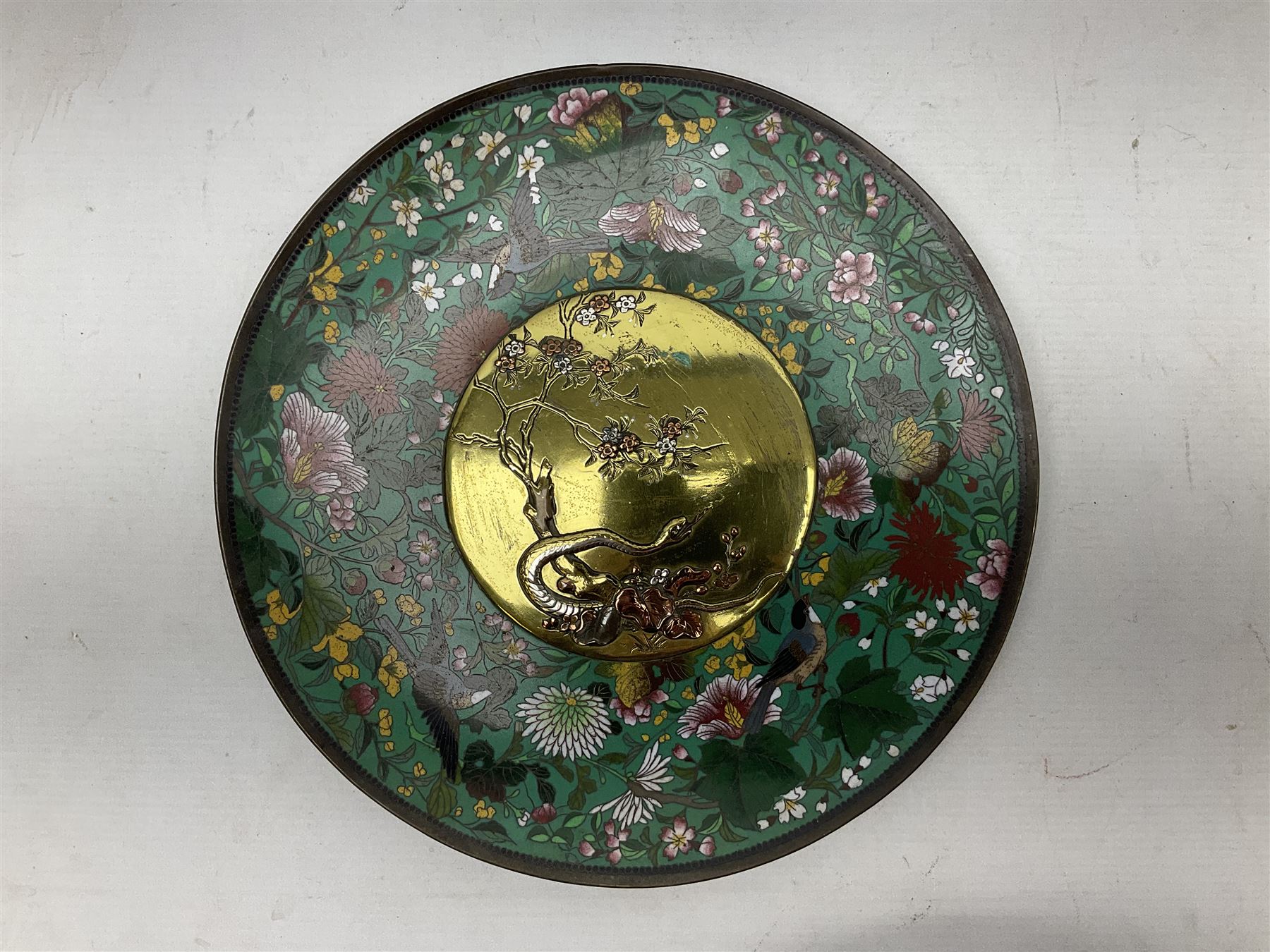 Cloisonné plate decorated with birds and flowers, together with a pair of Cloisonné vases of baluster form 