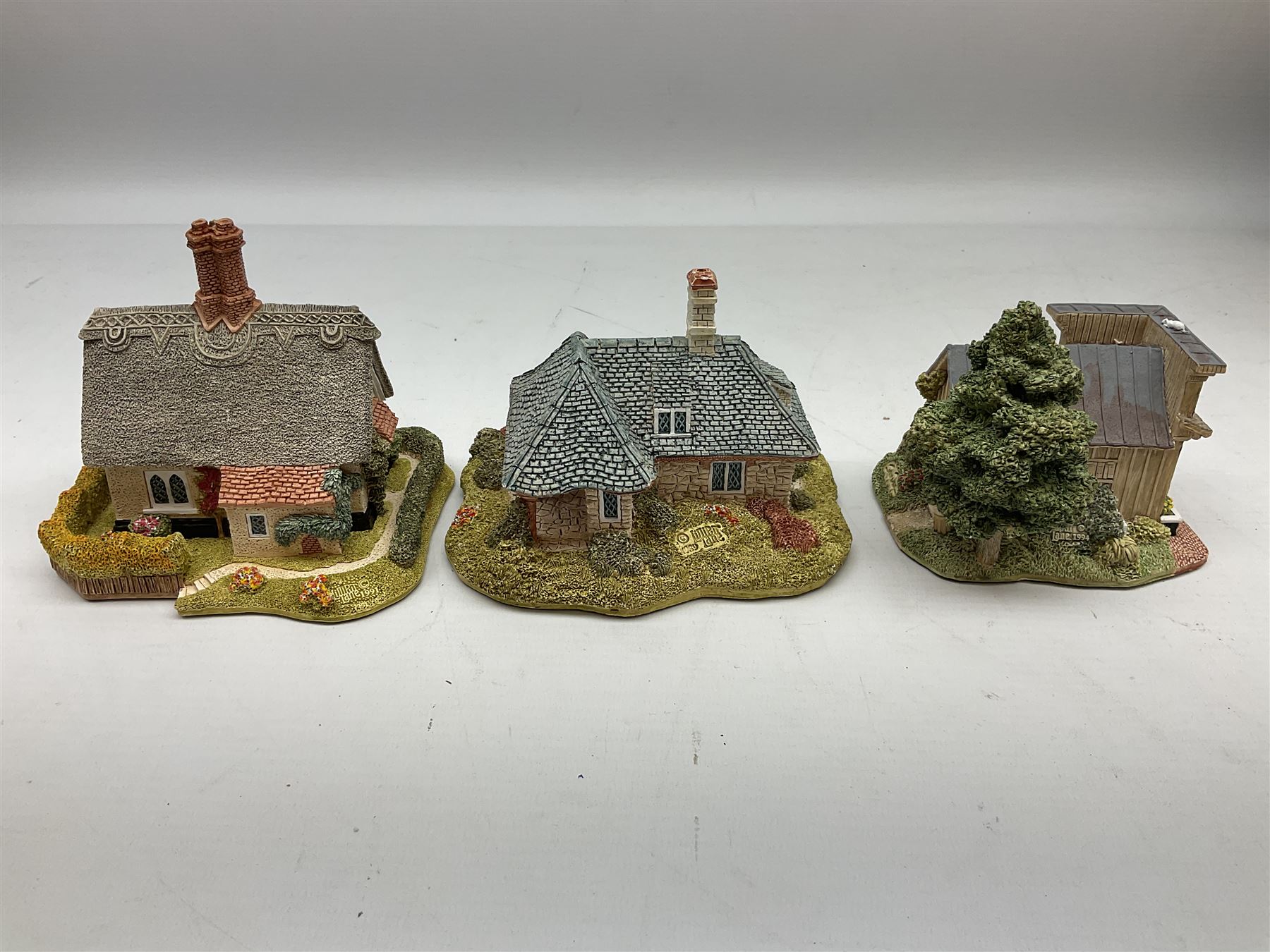 Eight Lilliput Lane models from the 'British Collection' to include six boxed and two loose examples, including 'Kenmore Cottage' and 'Hopcroft Cottage', some with deeds