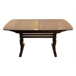 Ercol - late 20th century oak refectory dining table, rectangular top with rounded corners and central extending leaf, raised on turned baluster supports united by a stretcher (Extended 200cm)