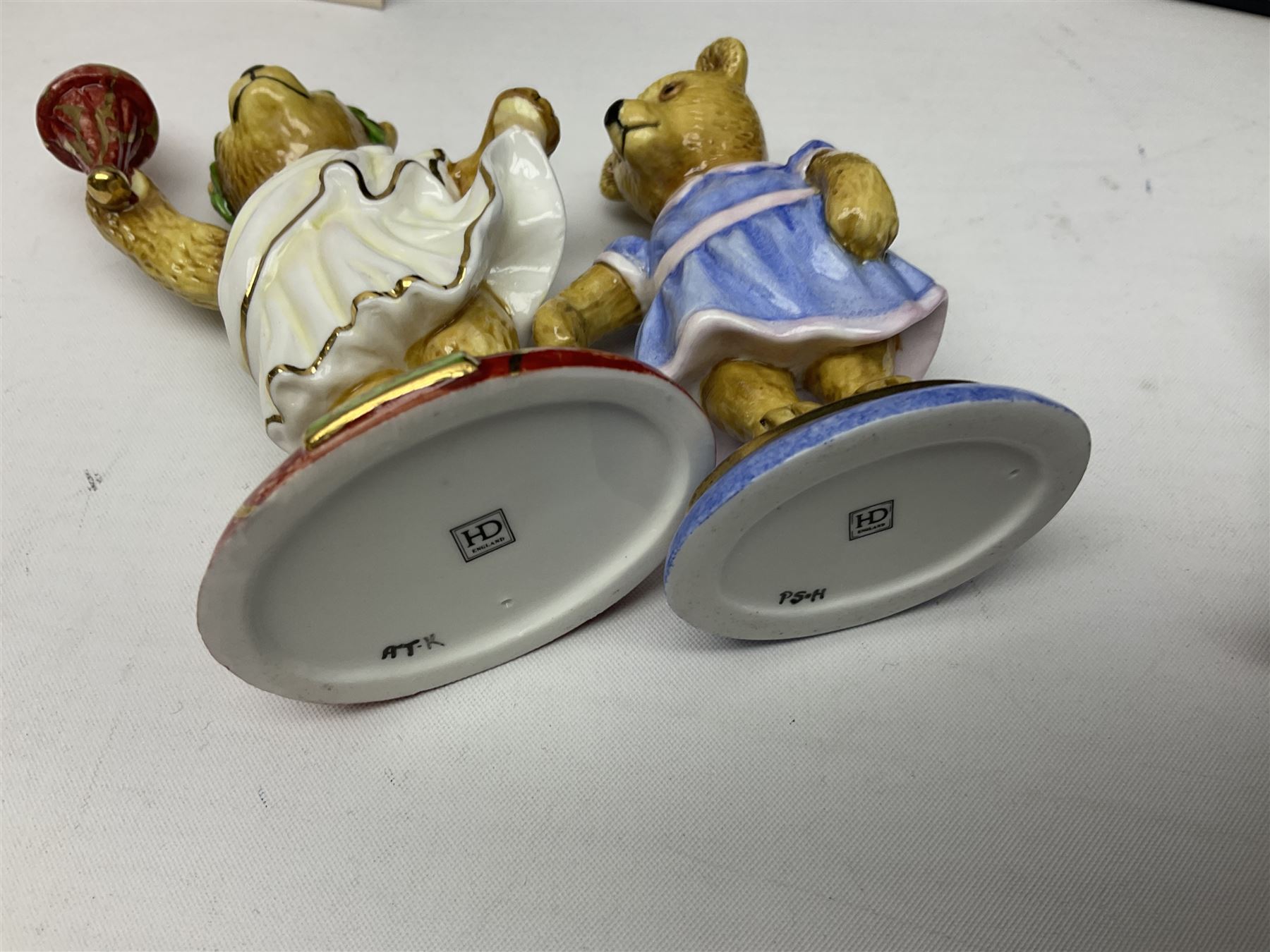 Eight Halcyon Days Teddy Bear of the Year figures, from 1993 to 2000, including one example modelled as a bear in Greek dress carrying a torch, one example modelled as a schoolboy and one example in a blue dress, all boxed 