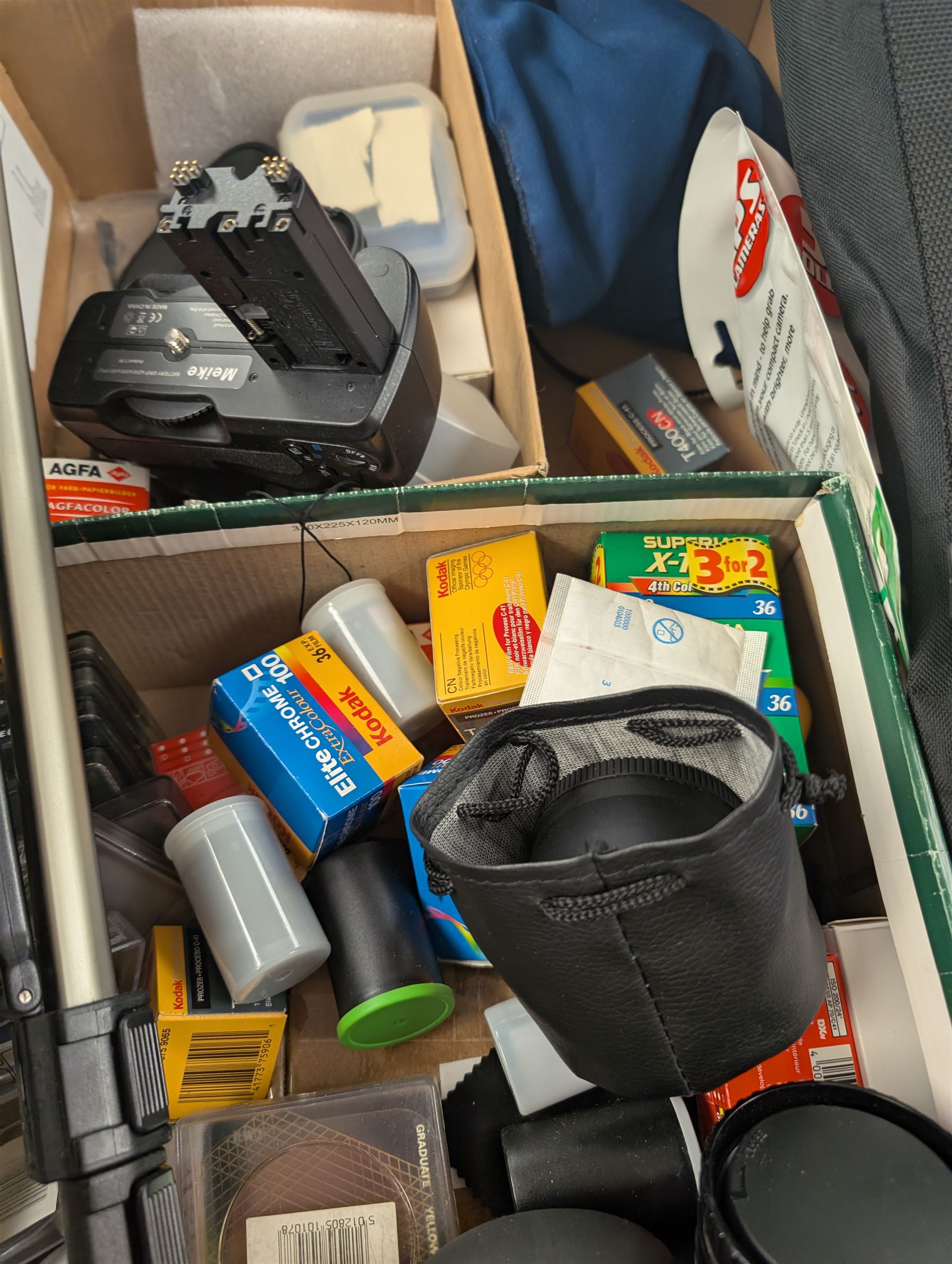 Minolta Dimage F300 digital camera and a Hitachi HDC-1499 digital camera, both boxed, together with a collection of camera accessories including filters, straps and cases 