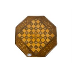 Late 19th century inlaid walnut sewing or work table, octagonal hinged top with satinwood and ebony chessboard inlay, surrounded by foliate decoration, the edges inlaid with crossbanding and stringing, fitted interior with chess pieces, raised on baluster pedestal carved with acanthus leaves on a tripod base 