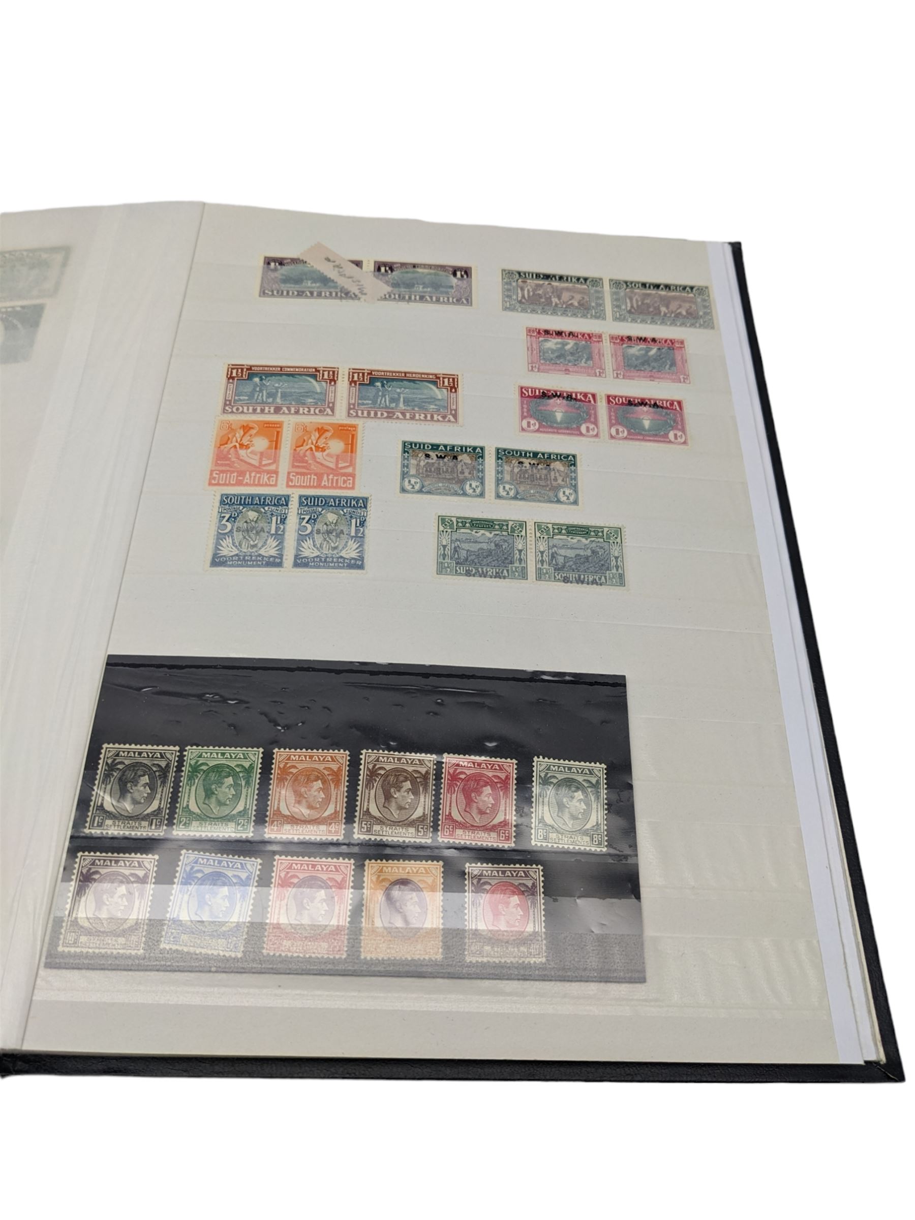 World Stamps including Seychelles, Southern Rhodesia, Sudan, Cyprus, Bermuda, Queen Victoria Canada, King Edward VII Straits Settlements etc, mixture of mint and used values, housed in a black stockbook
