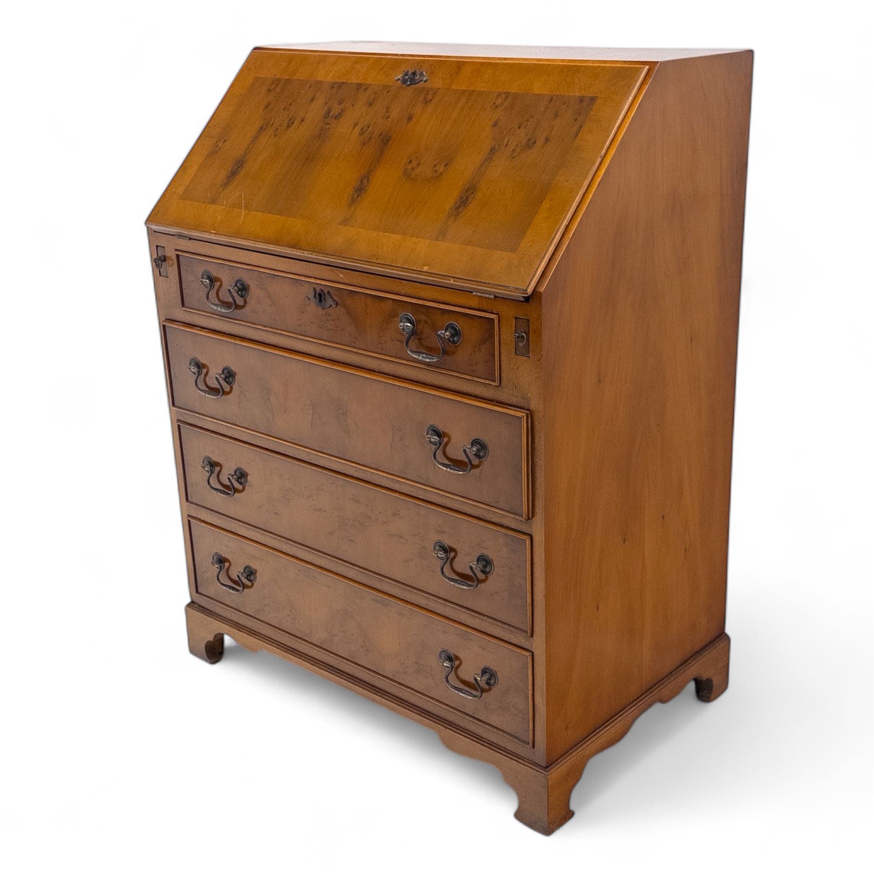 Mid-20th-century Georgian design cherrywood and burr walnut  veneered bureau, fall front with inset tooled leather writing surface revealing a fitted interior with small drawers and pigeon holes, and a central cupboard with oval inlay, over four long graduated drawers, raised on shaped bracket feet 