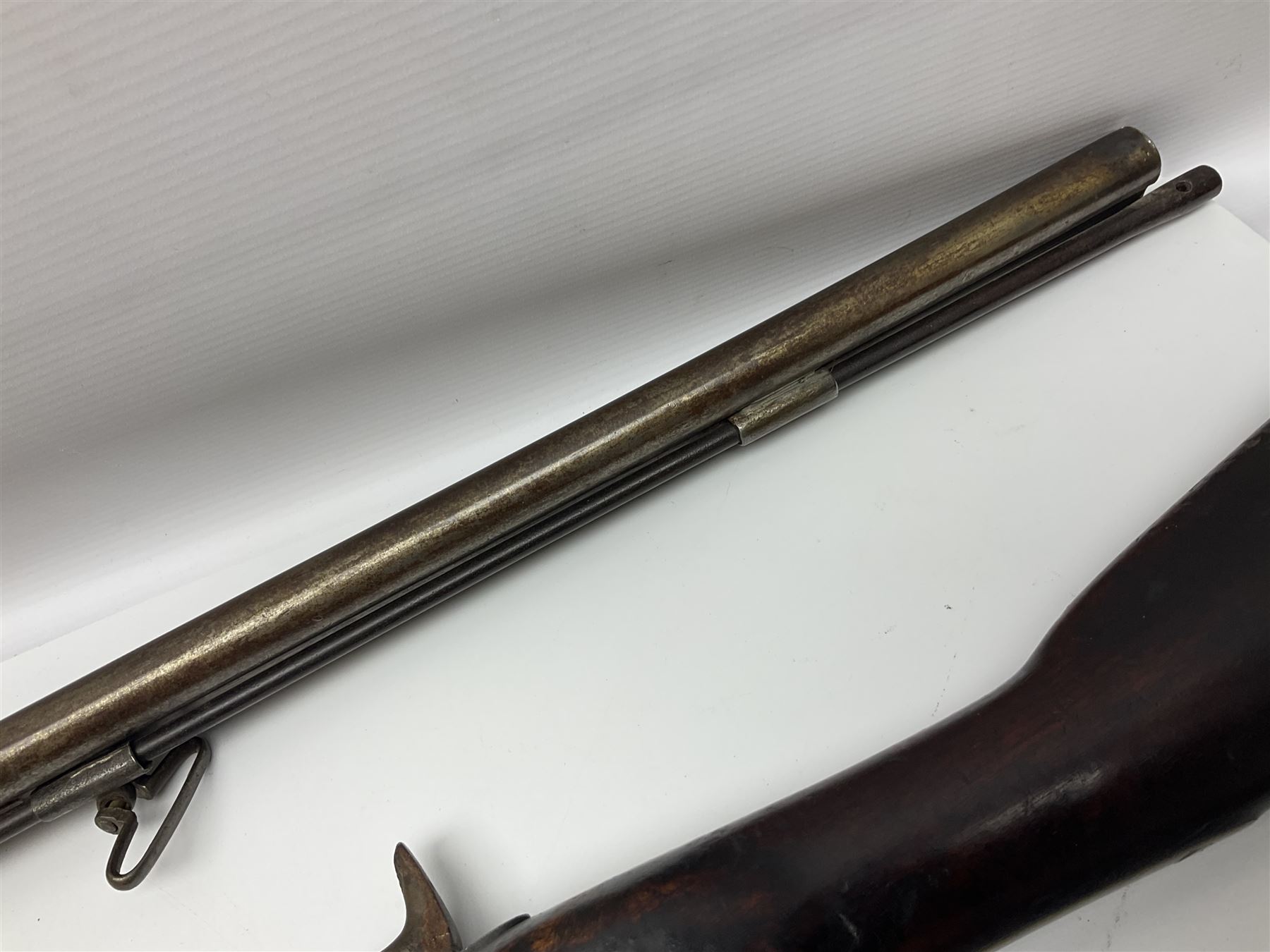19th century Indian .577 Enfield muzzle loading rifle, proofed for 26-bore, the 98.5cm barrel with three barrel bands and later ram rod L140cm overall; 19th century Belgian side-by-side double barrel percussion shotgun, approximately 20-bore, with 74cm barrels and studded walnut stock, lock plate marked 'Liege 1868' and 'V. Gulikers-Maquinay' L117cm overall; and another side-by-side double barrel shotgun by Smythe with underlever opening (3)