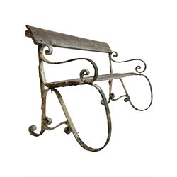 19th century wrought metal garden bench, wooden slats on scrolled iron work, with S-scroll arms and stretcher rails