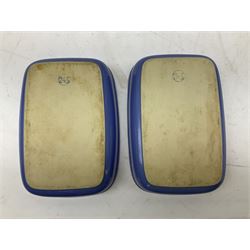 Emile Henry covered casserole dish of oval form in two tone brown and cream, no. 03.06, together with cast iron Nomar twin handled lidded casserole dish of oval form in navy, and other ovenware including Flintware ICTC, largest L35cm