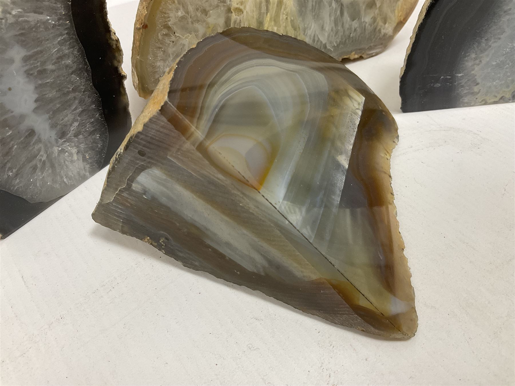 Four polished blue agate geodes, largest H10cm, L18cm