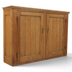Victorian waxed pine low cupboard, fitted with two panelled doors and panelled sides, two ...