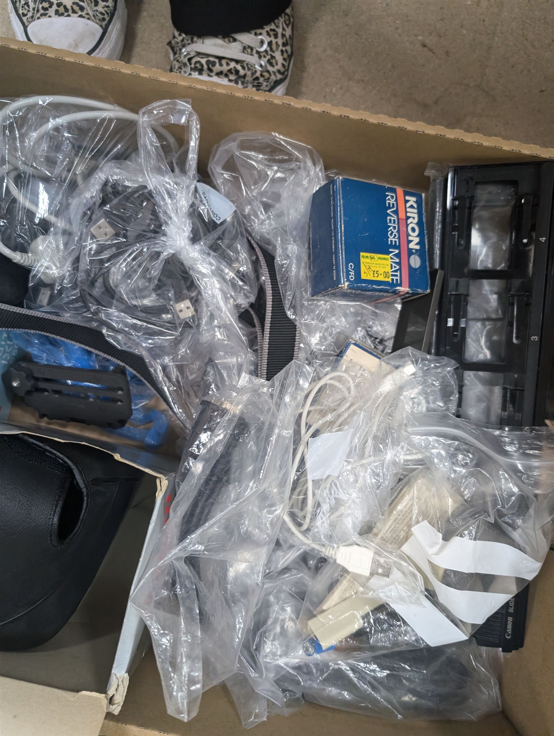 Collection of predominantly Canon camera accessories, including CanonScan FS40000US, cases, straps, cables, etc 