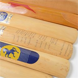 Signed International cricket memorabilia, comprising Alan Donald signed Kookaburra Commander cricket ball, wide brimmed hat signed by Darren Sammy and other West Indies players and a collection of signed miniature cricket bats, each with signatures of International cricket players including Brian Lara, Grant Flower, Richard Hadlee, Zimbabwe vs Rest of World 1993, South Africa vs Presidents VI 1994, Eastern Province South Africa 1992 and South Africa Touring Side Scarborough 1994