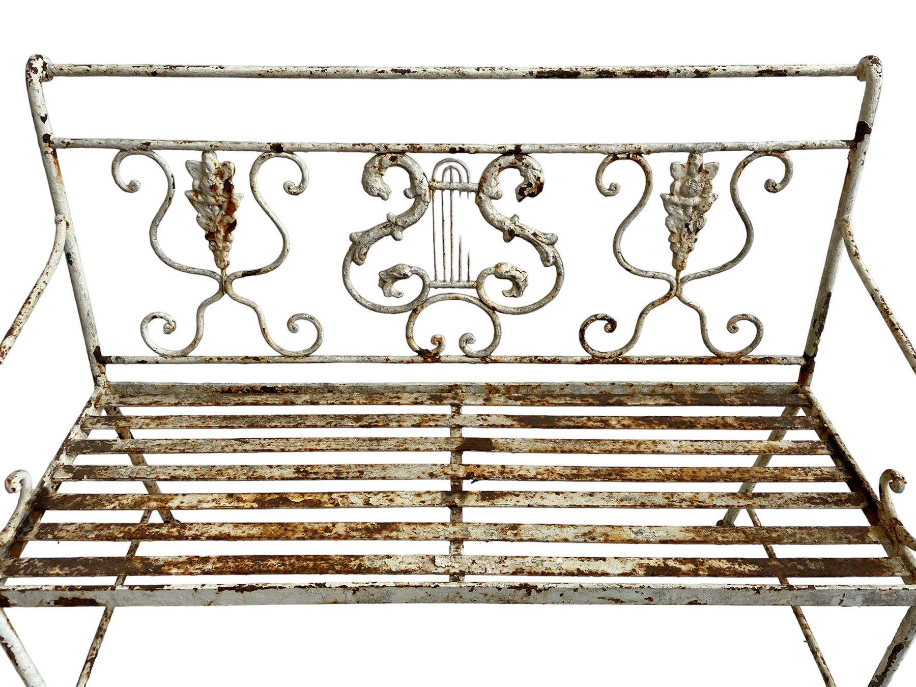 Regency design wrought metal garden bench, central lyre back with foliate S-scrolls with serpent masks, flanked by two floral mouldings and further scrolling, metal slatted seat on straight supports joined by H-stretcher  - THIS LOT IS TO BE COLLECTED BY APPOINTMENT FROM DUGGLEBY STORAGE, GREAT HILL, EASTFIELD, SCARBOROUGH, YO11 3TX