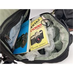 Four camera bodies, to include, Ricoh KR-10 serial no. 38826, Pentax MZ-M serial no. 4185969 with 'SMC Pentax- M 1:3.5 28mm' lens, Canon EOS500 serial no. 080927, with 'Sigma Zoom 100-300mm 1:4.5-6.7 DL'  lens etc, with other camera lenses and equipment 