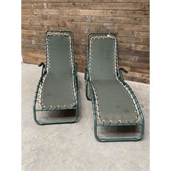 Pair metal framed folding sun loungers