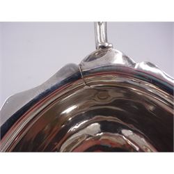 Victorian silver sauce boat, of typical plain form, with shaped rim and acanthus capped flying scroll handle, upon three hoof feet, hallmarked Walker and Hall, Sheffield 1899, including handle H12cm