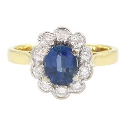 18ct gold oval cut sapphire and round brilliant cut diamond cluster ring, London 1984, sap...
