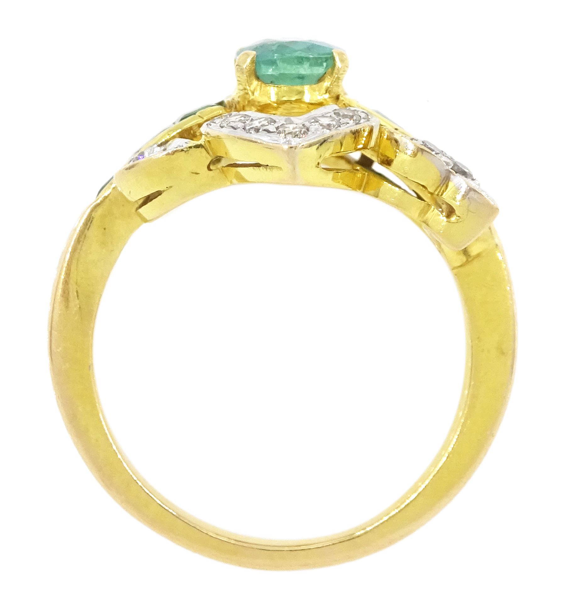 Gold emerald and diamond ring, the principal oval cut emerald, with three calibre cut emeralds set either side, within a diamond set fancy openwork setting