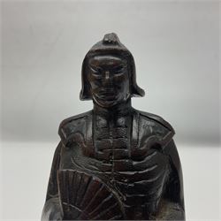 Japanese carved wood figure of a Samurai style gentleman holding a fan, 20cm