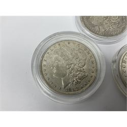 Three United States of America silver Morgan dollar coins dated 1881 O, 1882 and 1882 O