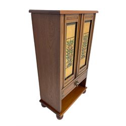 19th century and later walnut cabinet, enclosed by two doors with pained and carved floral decoration, fitted with drawer and shelf to base