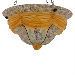  Early 20th century painted glass ceiling light fitting, the domed shade decorated with figural panels alternating with scrolling foliate and floral reserves, centred by a moulded knop finial, in amber and pastel tones