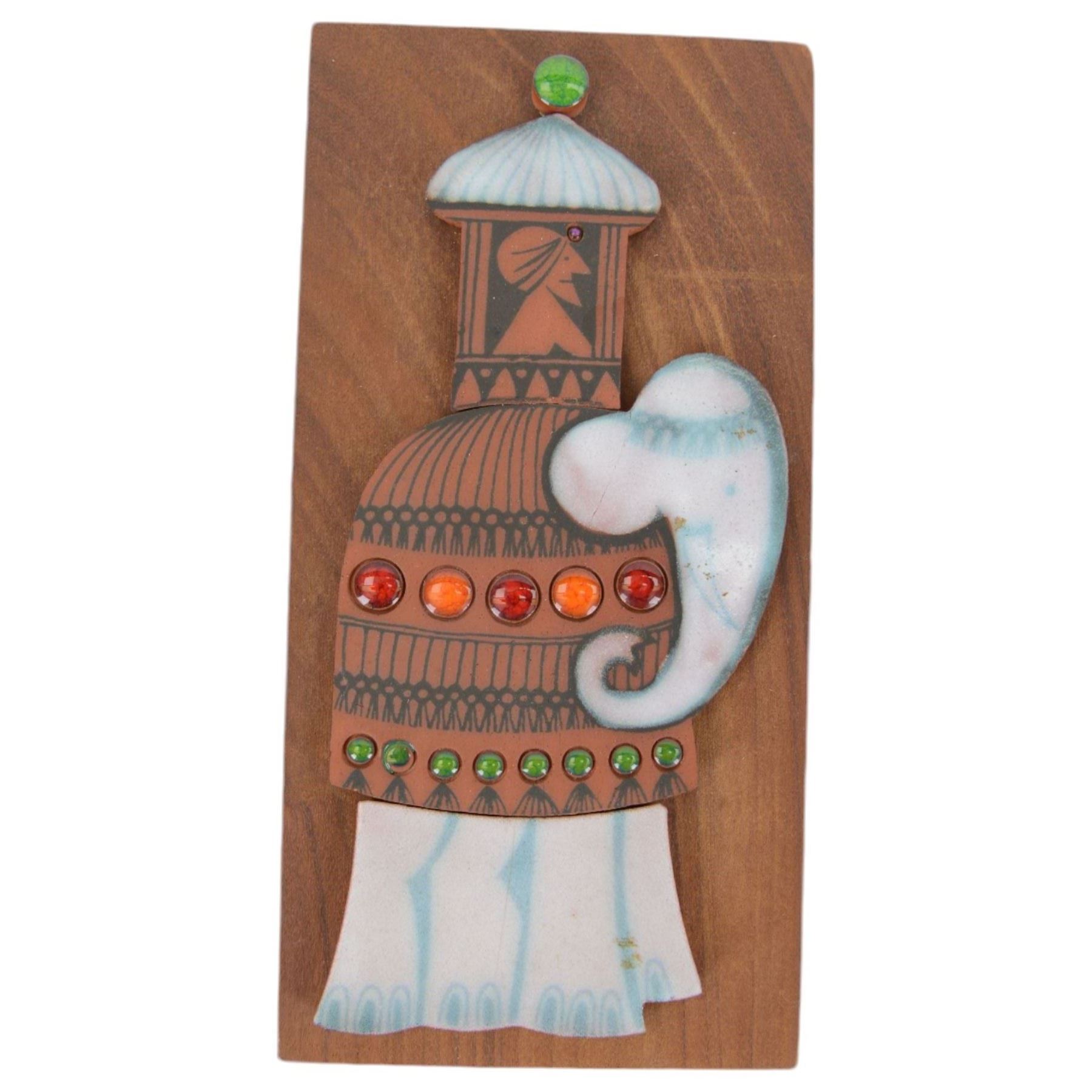 Three Hornsea Muramic handcrafted wall plaques, comprising Spaceman, Jester and Maharajah on Elephant, designed by John Clappison, H21cm, W10cm