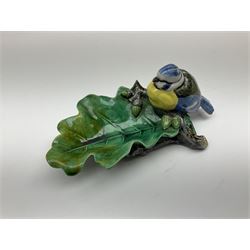 Minton majolica leaf dish, modelled as a Blue Tit perched on a branch with acorns and an oak leaf, date cypher for 1868, impressed marks beneath, L21cm. 