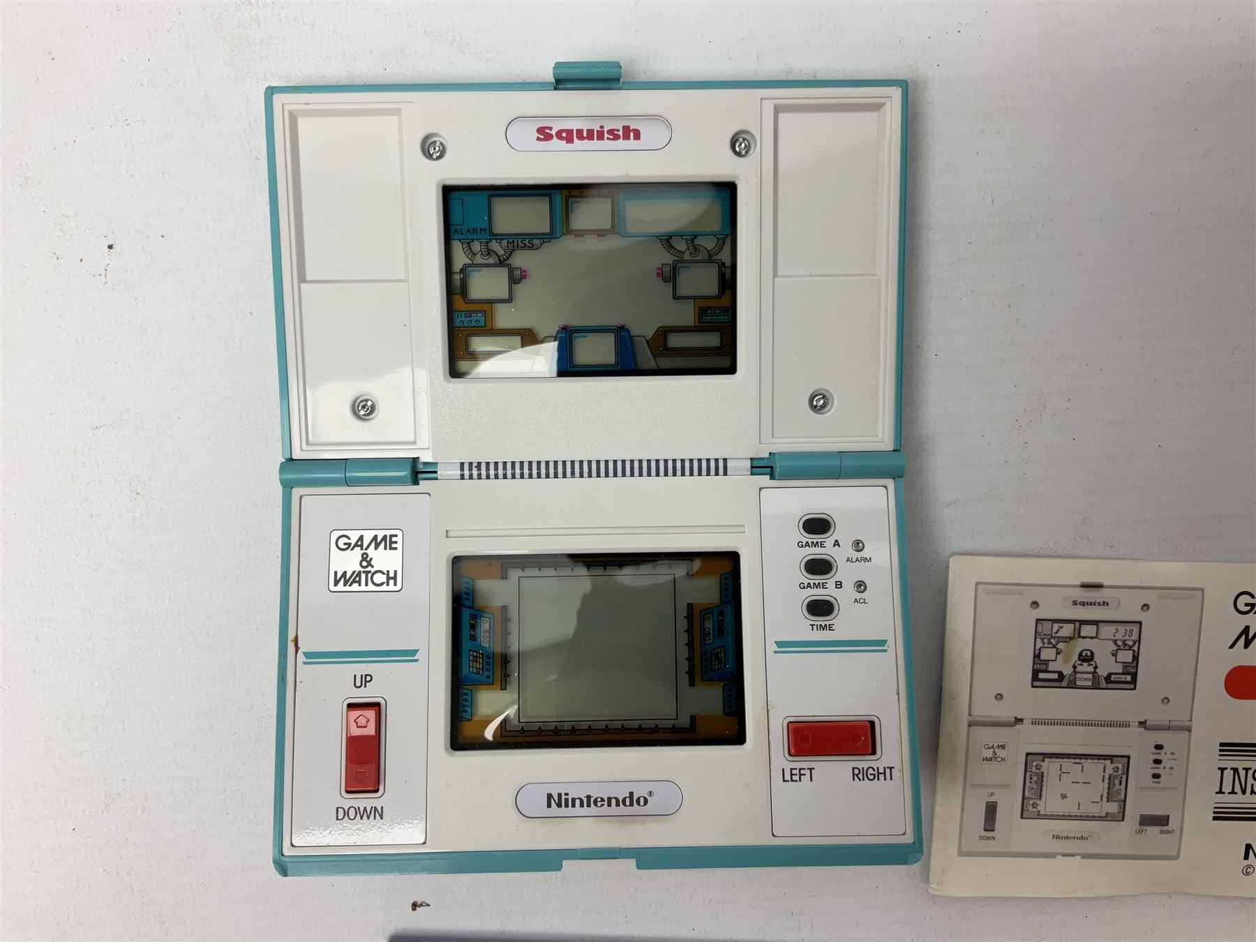 Collection of retro handheld games, including Nintendo Game & Watch ‘Snoopy Tennis’ (1982) and ‘Squish’ (1986) both with instruction booklets, Casio CG-600 ‘Star Invader’ with box, 3 in 1 LCD cartridge game including ‘Soccer’, ‘Invader’ and ‘Bomb Finder’ games, and two Grandstand ‘Pinball Wizard’ (1988) games, both with original boxes
