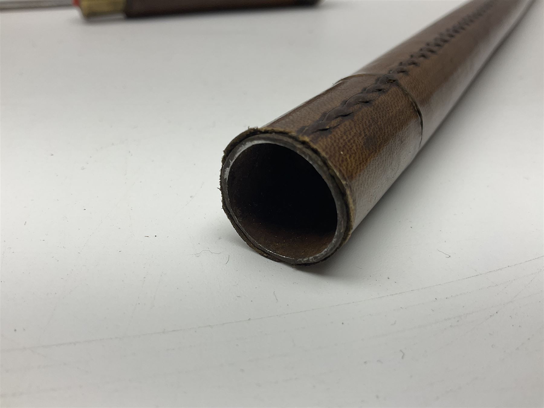 Leather covered swagger/sword stick with 40cm steel blade L62cm overall; another ash sword stick with 30cm diamond section steel blade; pair of fencing foils, the blades marked Solingen; two reproduction flintlock pistols; and 92cm inert cartridge belt (7)