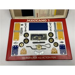 Meccano - Outfits 2, 3 & 4 with blue and yellow parts; look to be virtually complete with most apertures filled; together with a partially stocked Meccano Elekrikit; all boxed with instruction manuals (4)
