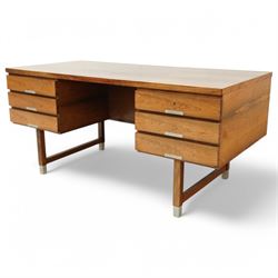 Mid-20th century rosewood pedestal desk, the rectangular top above twin pedestals each fitted with three drawers, all with recessed metal pulls, raised on square legs with stretcher supports and capped metal feet
