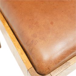 Acornman - set of four oak dining chairs, chamfered slatted back, tan leather drop in seat, raised on square supports with carved acorn signature, by the workshop of Alan Grainger of Brandsby