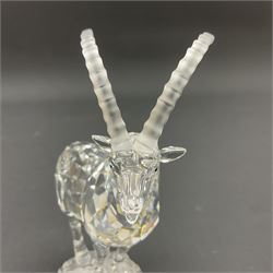 Swarovski Crystal animals, comprising white peacock, the tail with cascading blue flowers, perched eagle with yellow beak, ibex with frosted crystal horns and unicorn with frosted crystal horn, tallest H13cm