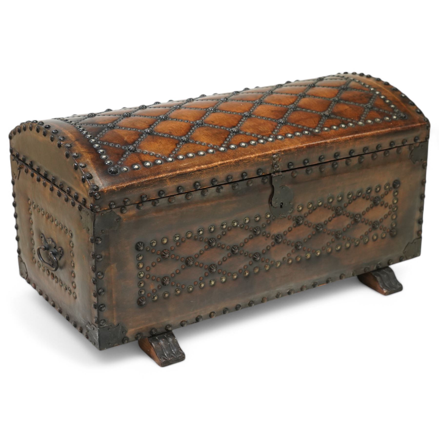Studded leather dome top trunk, the hinged lid and front decorated with cross pattern in studs, on sledge feet 