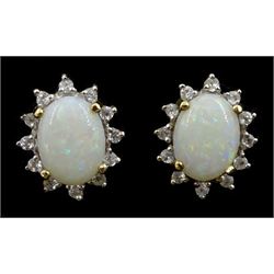 Pair of gold opal and cubic zirconia cluster stud earrings, stamped 10K