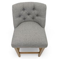Contemporary set of three upholstered bar stools, each with button-tufted grey fabric backrest and seat, raised on light oak finish square legs united by stretchers