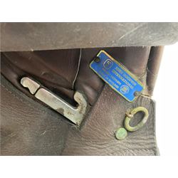 Collection of nine saddles, mainly havana leather to include a racing saddle and a Goodwin saddle, some with stirrups and leathers 