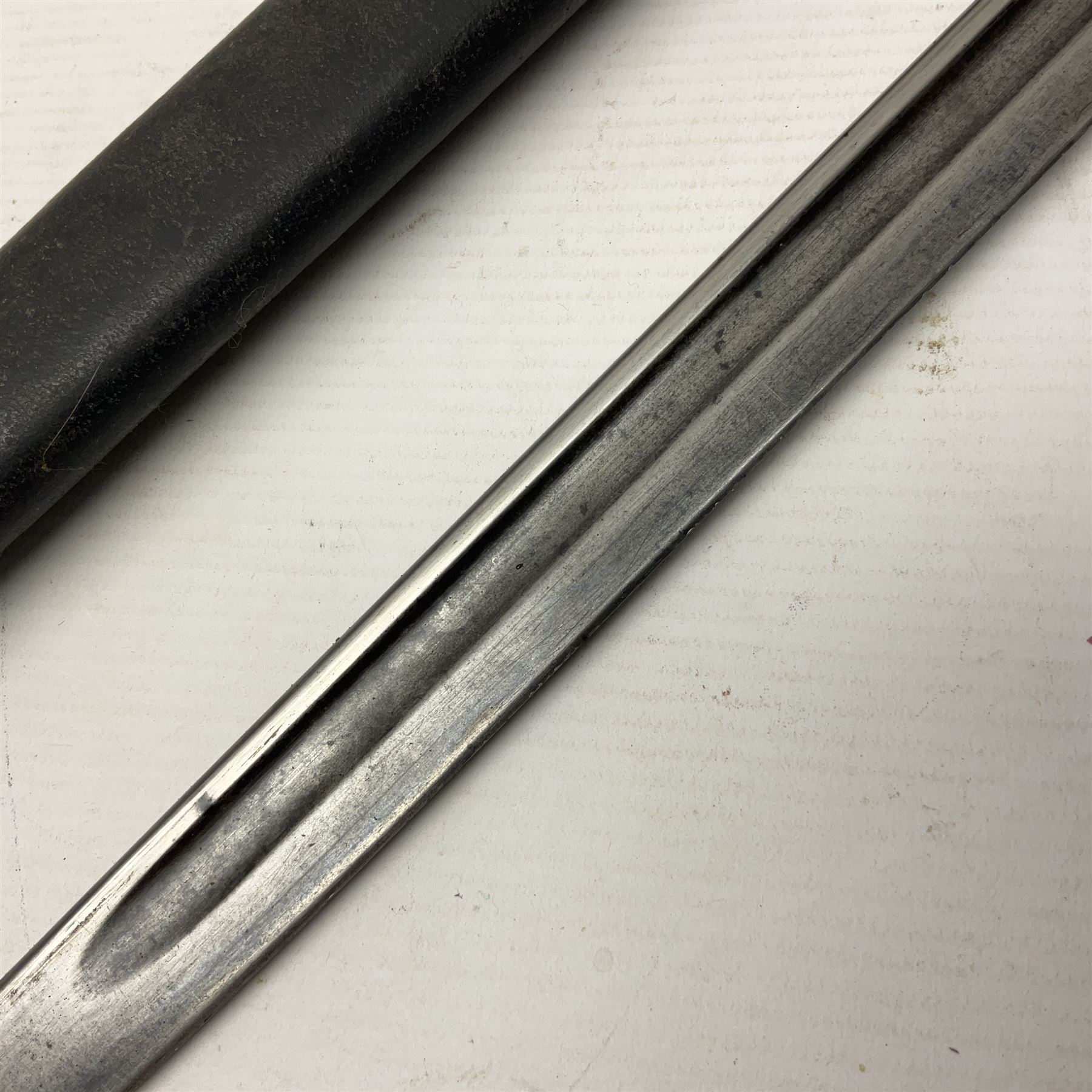 WWI British 1907 pattern bayonet, the 43cm fullered blade by Wilkinson with various marks to the ricasso; in leather covered scabbard numbered 294 to the throat and stamped M/58 L58.5cm overall