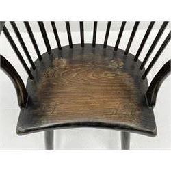 Primitive style elm and oak comb back Windsor armchair, the eared cresting rail over high stick back, concaved elm seat on plain supports joined by H stretcher, green paint finish 