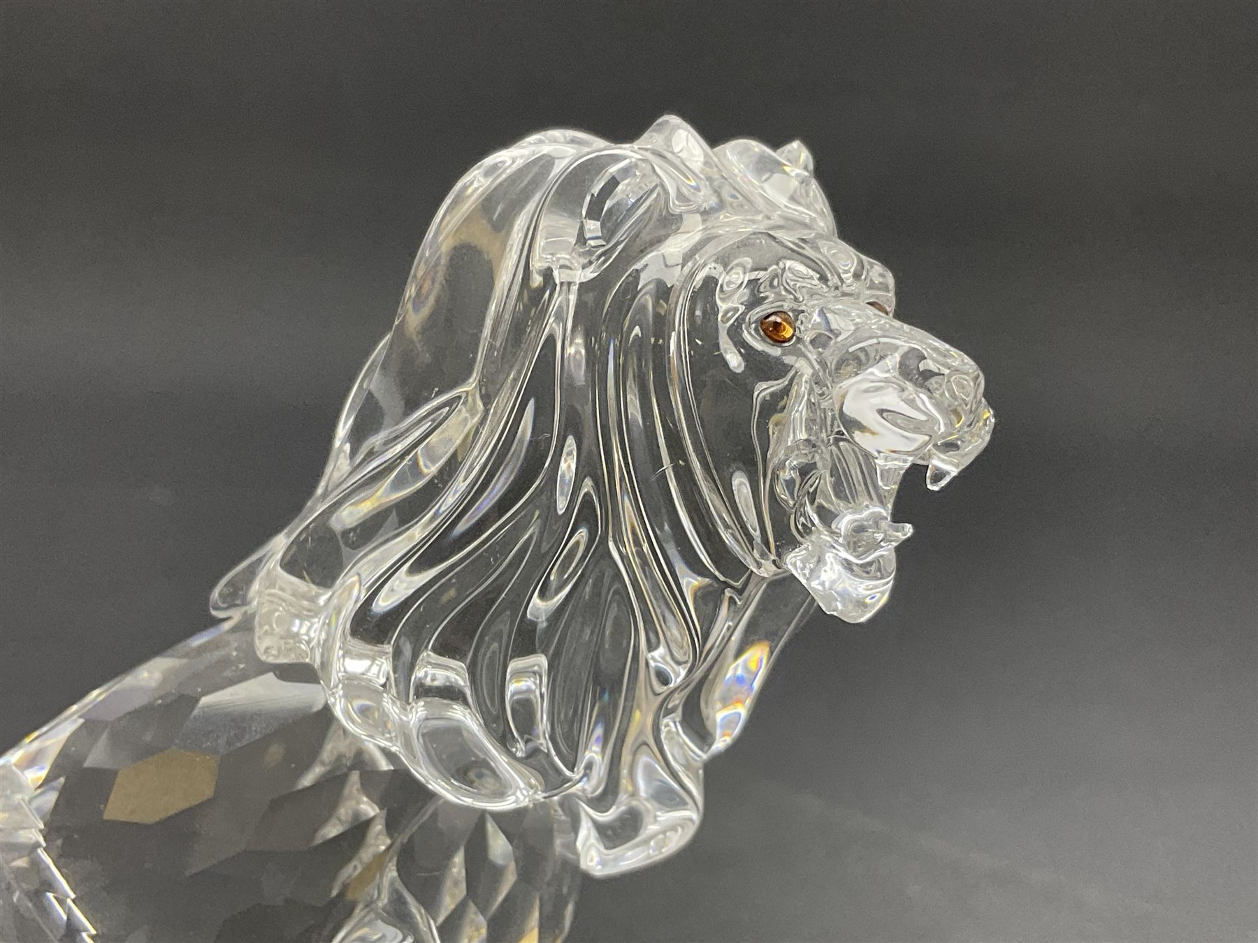 Swarovski Crystal animals, comprising camel and lion, both upon frosted crystal bases, together with Swarovski Crystal palm tree, upon similar frosted crystal base, tallest H14cm