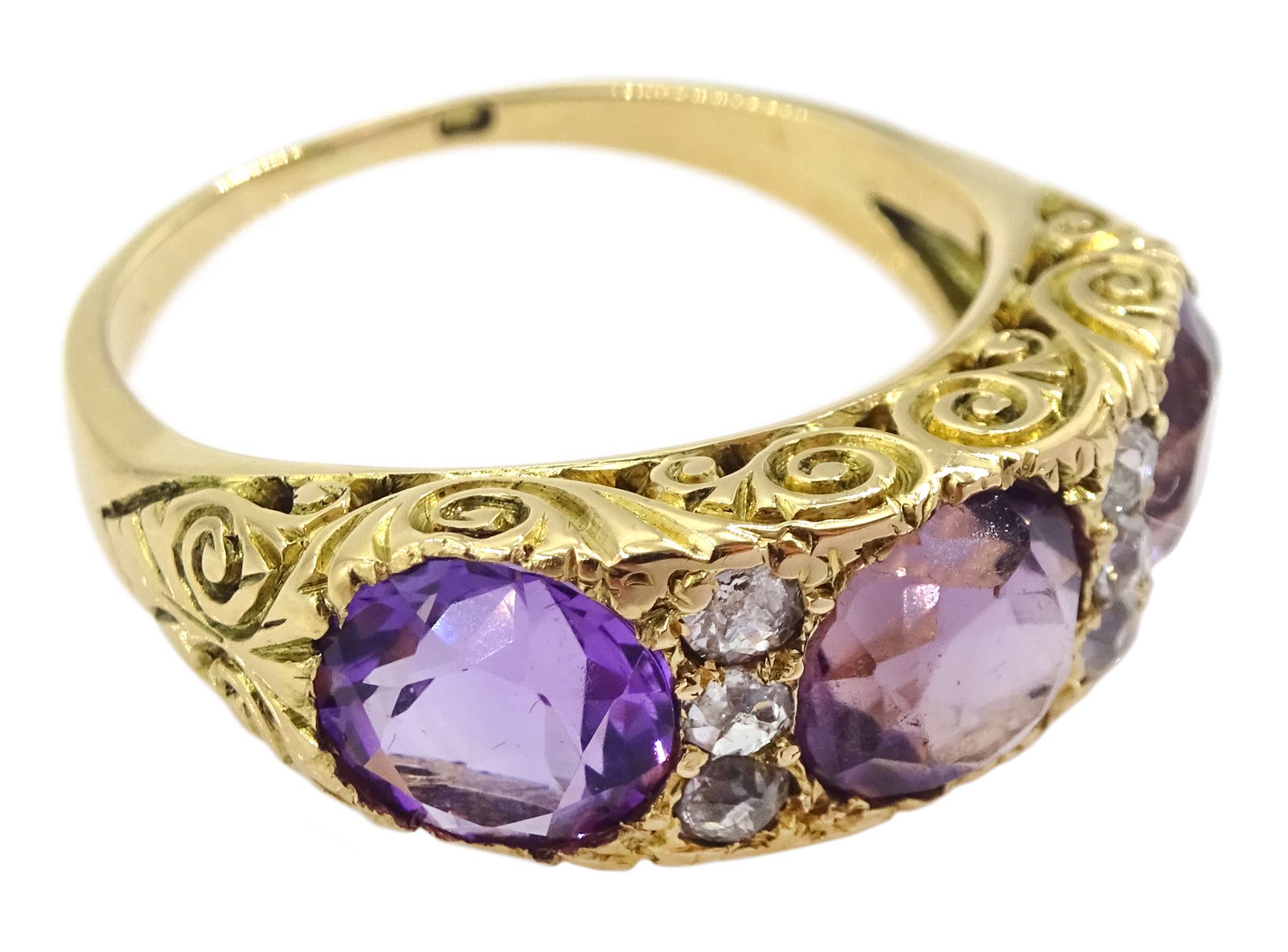 Dutch gold three stone round cut amethyst and six old cut diamond ring, stamped, total amethyst weight approx 3.95 carat