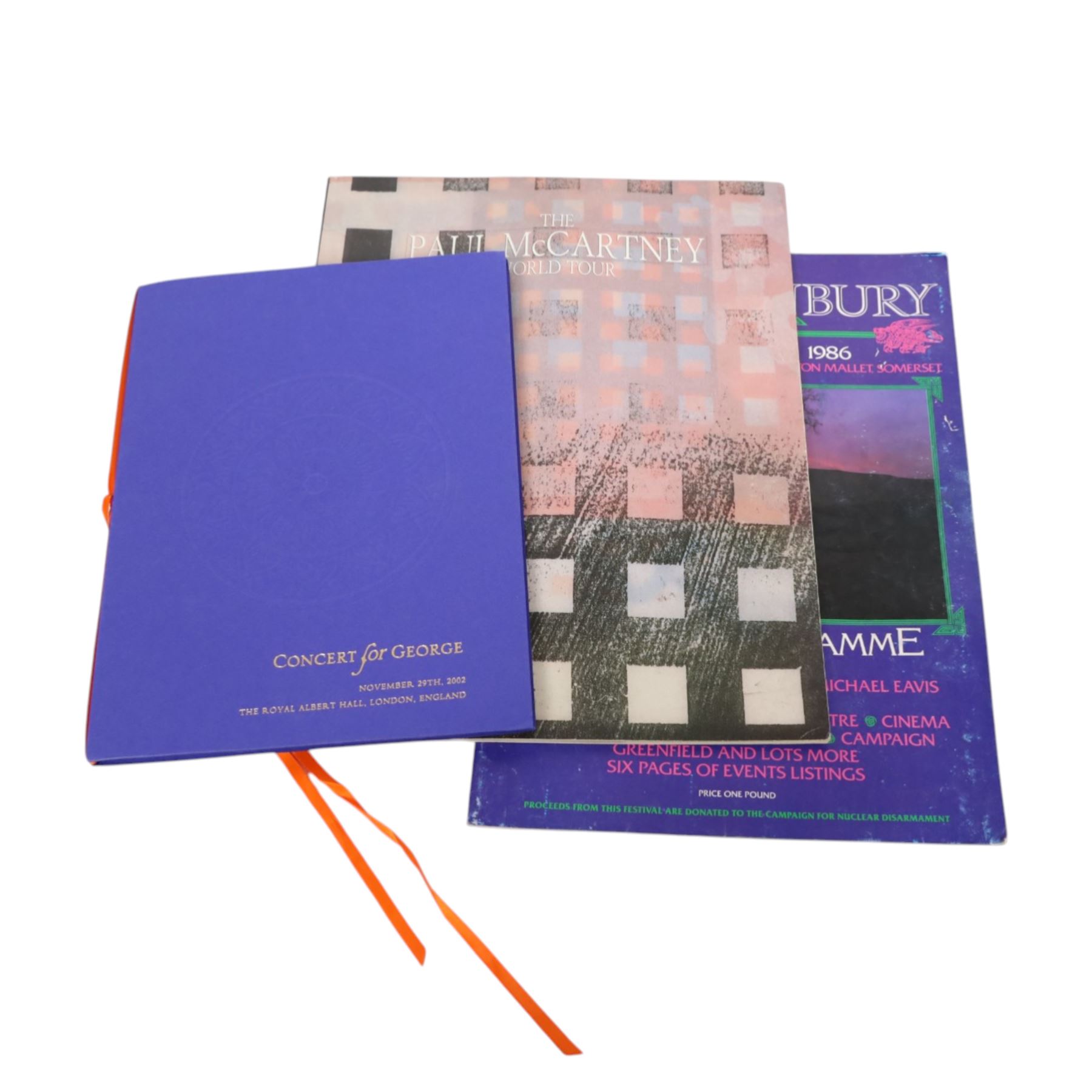 Music memorabilia, including cardboard globe, a free gift with the Wings Over America vinyl, music programmes, including Concert for George, Paul McCartney World Tour, Wings programmes, Glastonbury 1986, 10CC programmes, Knebworth Fair 1976 programme, etc