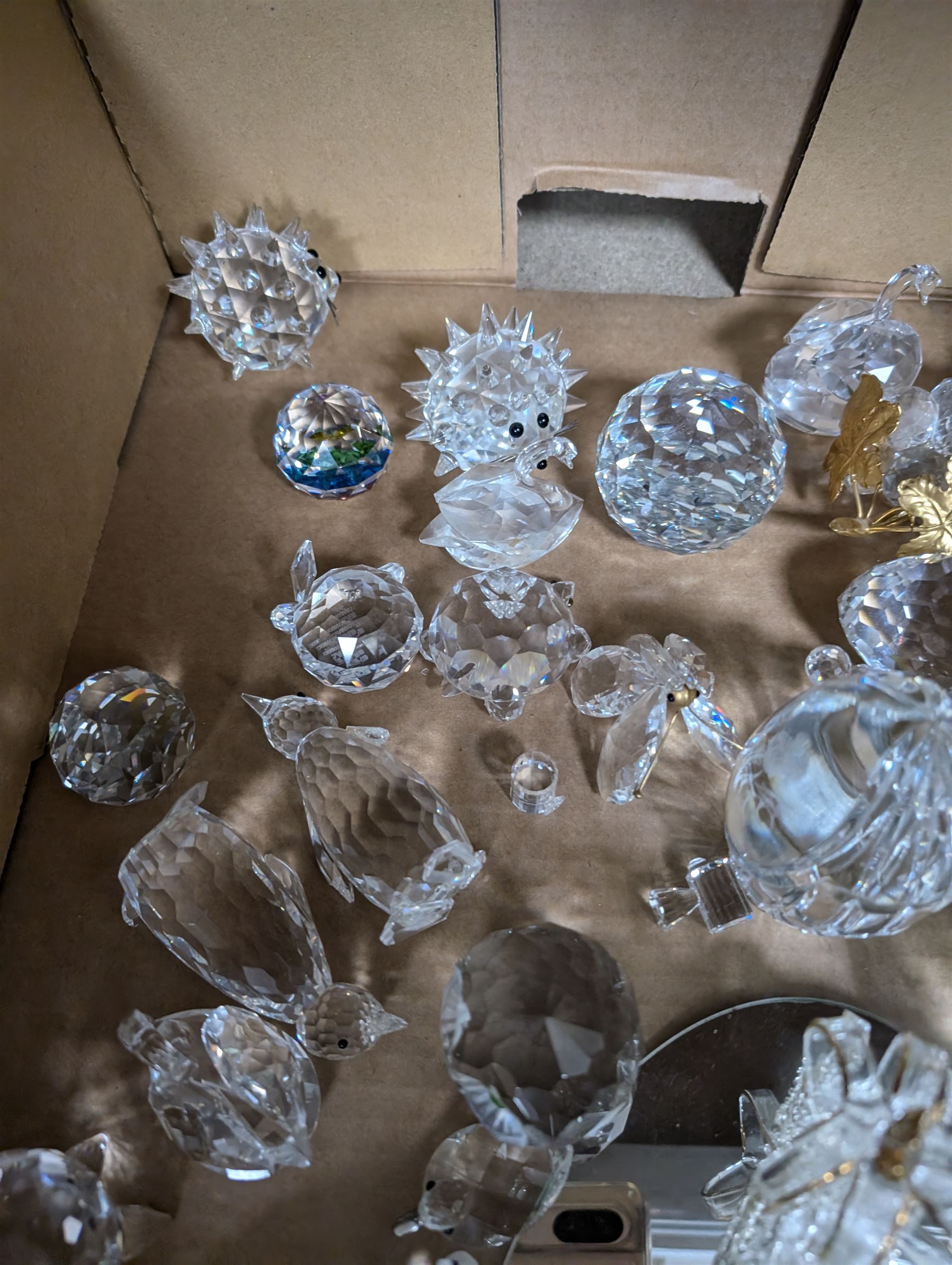 Collection of Swarovski figures, including owls, cats, penguins etc, together with Perthshire paperweight 