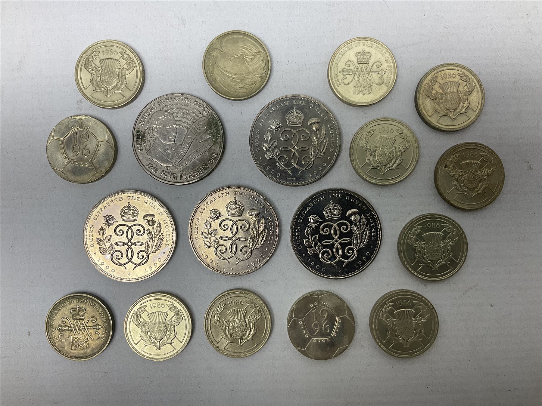 Five Queen Elizabeth II five pound coins and thirteen old style two pound coin