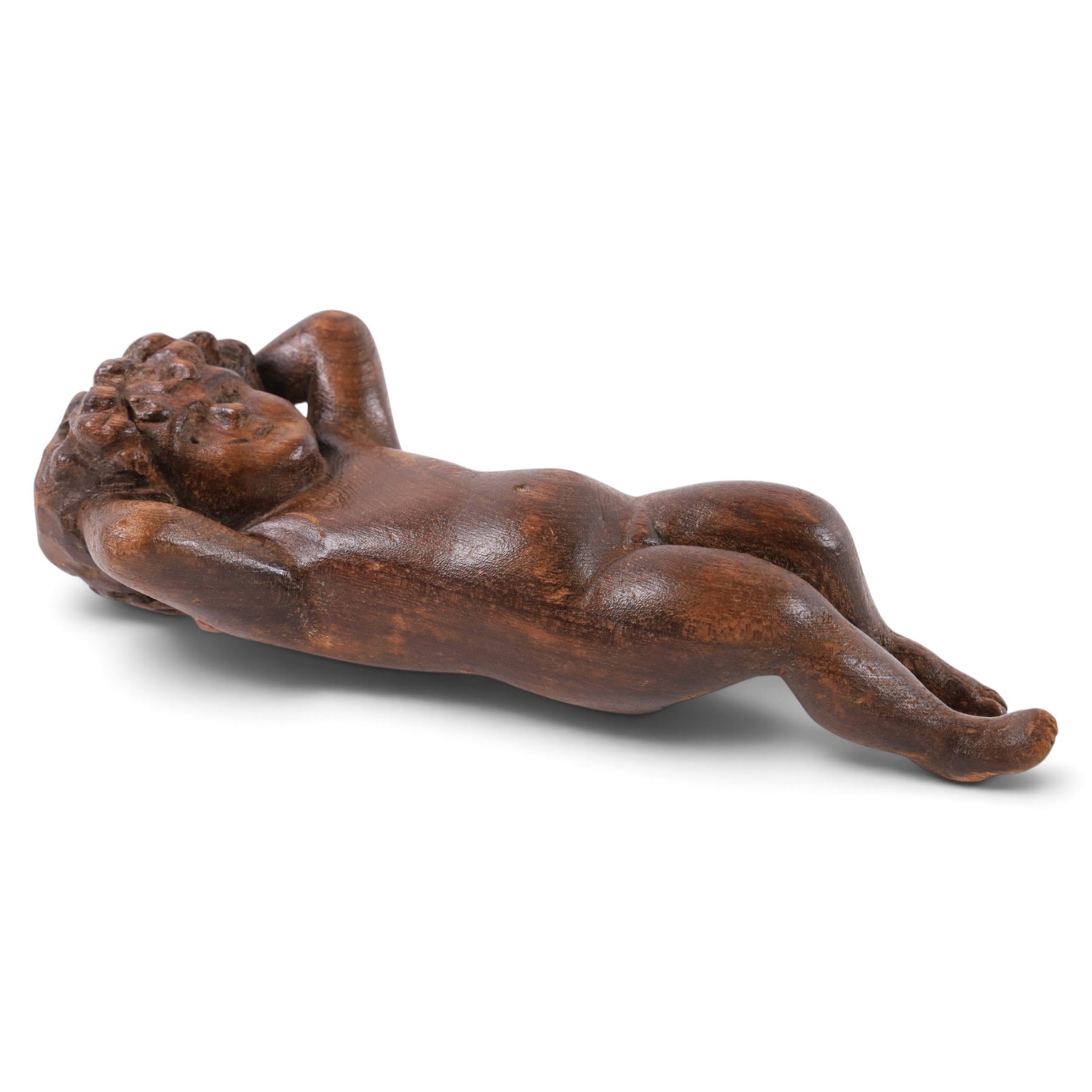18th century carved oak cherub, with hands raised behind head, H26cm 