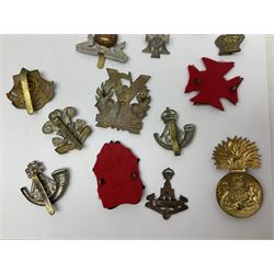 Over thirty regimental cap badges for fusiliers, Yorkshire interest, Light Infantry etc including Royal Scots and Welsh fusiliers, Durham L.I., KO Yorkshire L.I., Oxford & Bucks L.I., Green Howards, East Yorkshire, West Riding, York North Riding etc 