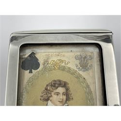 Edwardian silver mounted playing card case, hallmarked William Harrison Walter, Birmingham 1903, the sides each with a period playing card set behind a bevelled glass panel, the hinged cover with later engraving 'Presented to Norman T Crombie Esq by the officers & men of the 31st WR Detachment for services rendered 1917-1918', with red leather lined interior, the three compartments upon a sprung base and containing two later wooden Whist markers, case H12.5cm