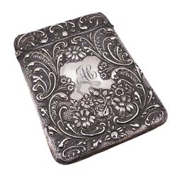 Edwardian silver card case, of typical rectangular form, with embossed floral and scrolling decoration throughout, engraved with monogrammed initials to front cover, hallmarked Cornelius Desormeaux Saunders & James Francis Hollings (Frank) Shepherd, Chester 1903, H9.7cm