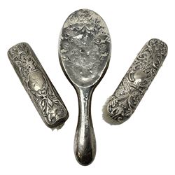 Three silver mounted dressing table brushes, all hallmarked