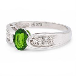 9ct white gold tsavorite garnet and diamond ring, single oval cut garnet with pave set diamond shoulders, Birmingham 2008